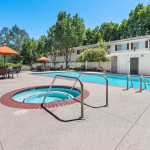 A pool and and an apartment, showcasing Los Gatos short term housing.